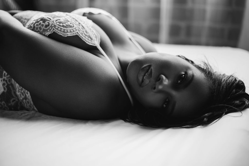 Woman gazes sensually into the camera of her Atlanta boudoir photographer looking like a goddess
