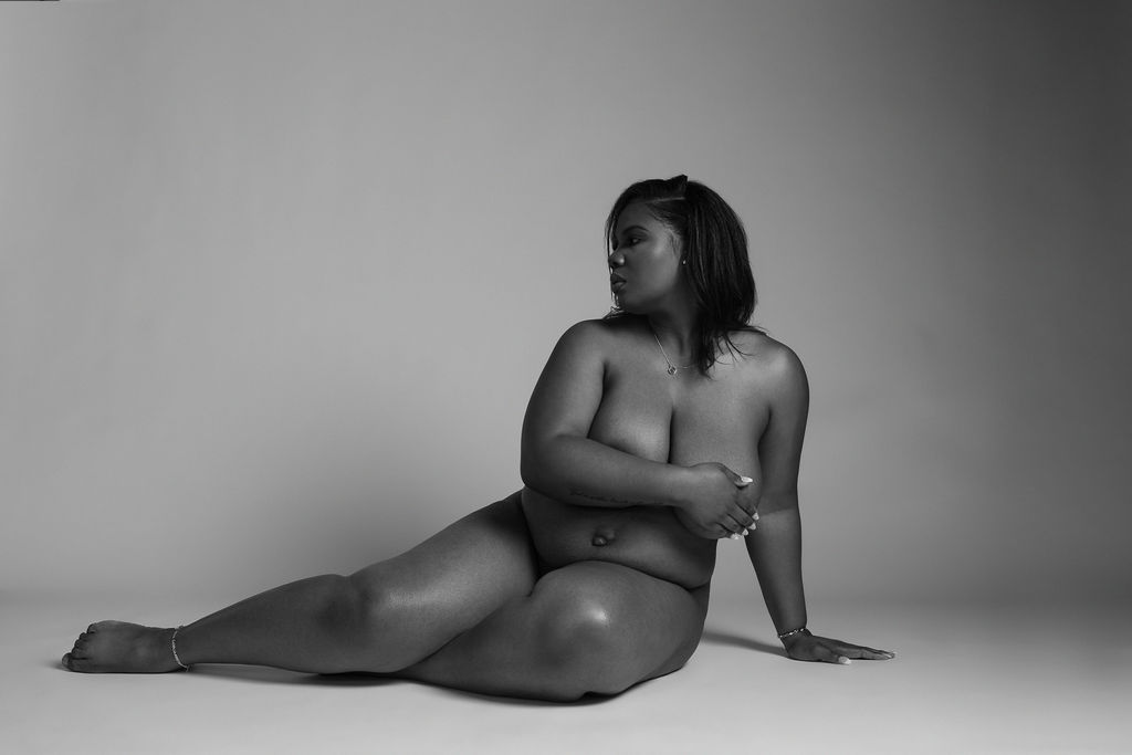 Photo of an expecting mom taken during her maternity boudoir photoshoot in Atlanta in black and white